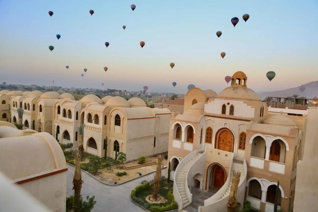 Omda Wellness Retreat with hot-air balloons overhead